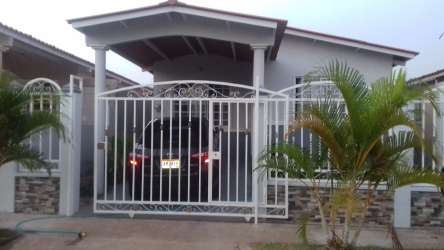 Kitchen with white cabinets and open tiled living dining room for rent Corotú Vacamonte Panama
