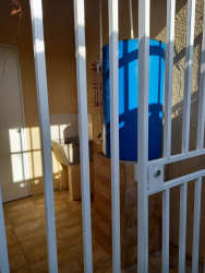 Bedroom with ceramic tiles and window with curtains rental house Corotú Panama