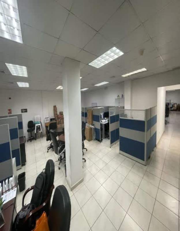 Aerial view of warehouse facility with parking, docks, surrounded by neighborhood Panama City