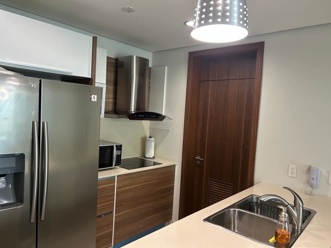 Open kitchen with stainless appliances granite counters wooden cabinets in PH Parkside