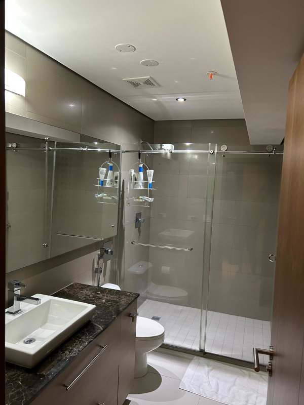 Double-height modern lobby with reception area at PH Parkside luxury building Costa del Este