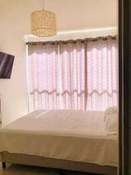 Covered balcony overlooking the Pacific Ocean at sunset in Playa Dorada beach condo Panama