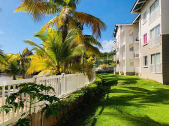 Resort-style pool with tropical landscaping at Playa Dorada beachfront community Arraiján Panama