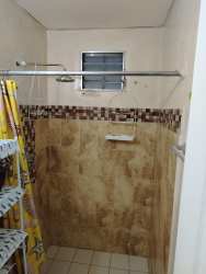 Bathroom with walk-in ceramic tile shower and window in La Chorrera Panama