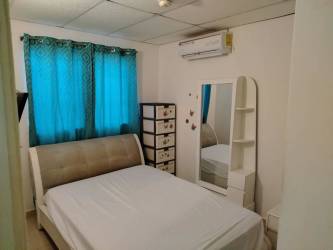 Bedroom with blue curtains, air conditioning, mirror and upholstered bed in La Chorrera Panama