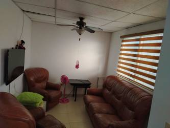 Living room with leather sofa, flat TV, tiled floor in furnished house Cocoli La Chorrera Panama