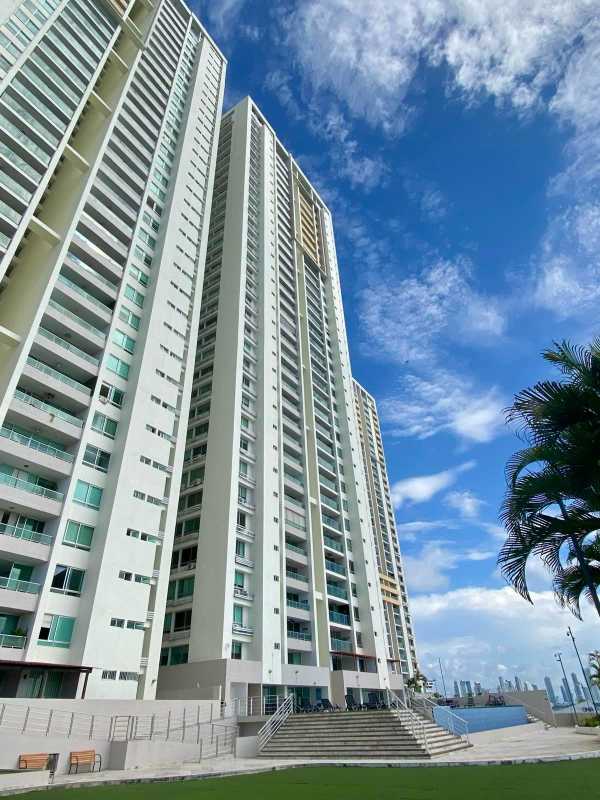 Tall condominium tower with balconies and landscaped entrance PH Terrawind San Francisco Panama