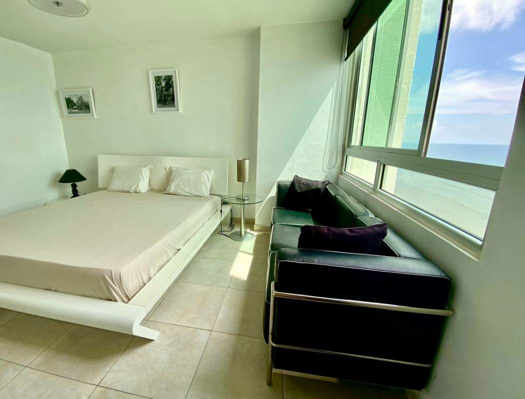 Bedroom featuring large window with Pacific Ocean views at PH Terrawind San Francisco Panama City