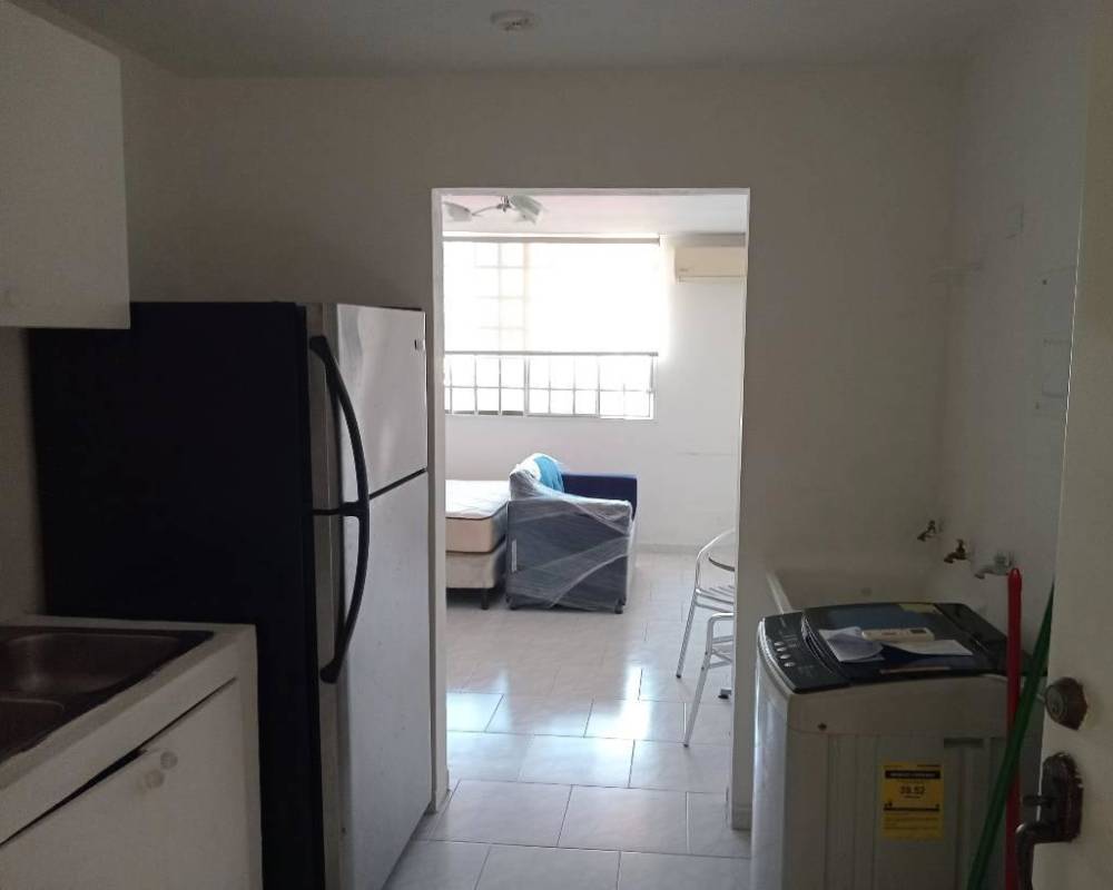 Compact kitchen with refrigerator, washing machine, living and sleeping area, Bella Vista Park Panama