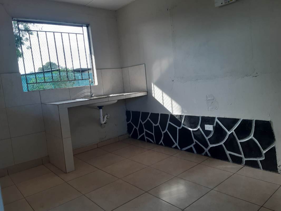 Simple kitchen with tiled countertop and sink room rental in Pacora Panama