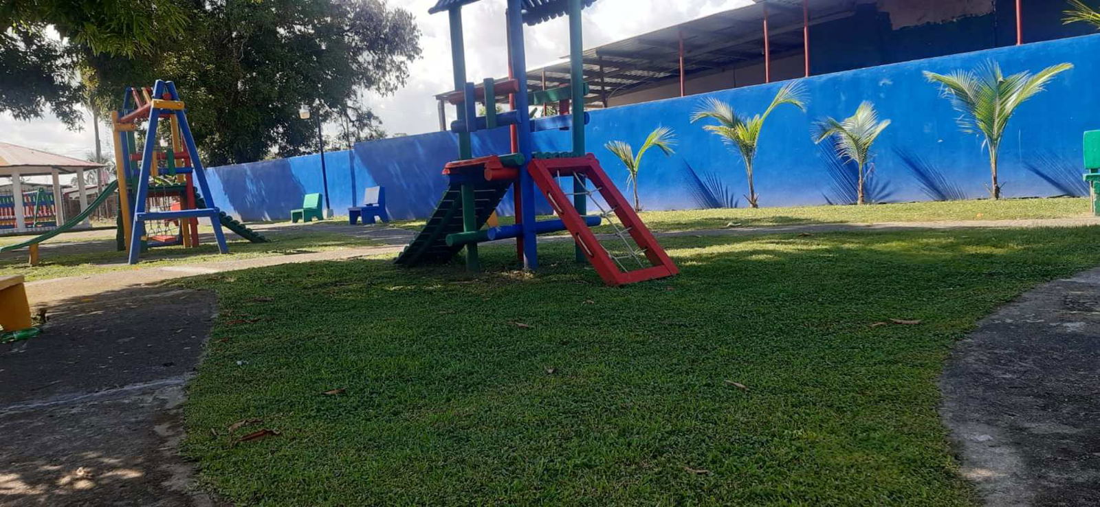 Colorful children's playground with lawn at affordable rental Pacora Panama