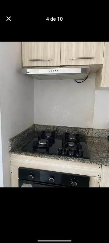 Bright living dining area with balcony access, ceiling fan, and urban views in PH Bella Natura Los Andes Panama