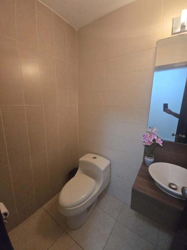 Bright minimalist bedroom with large window city view PH Parque del Mar Panama City