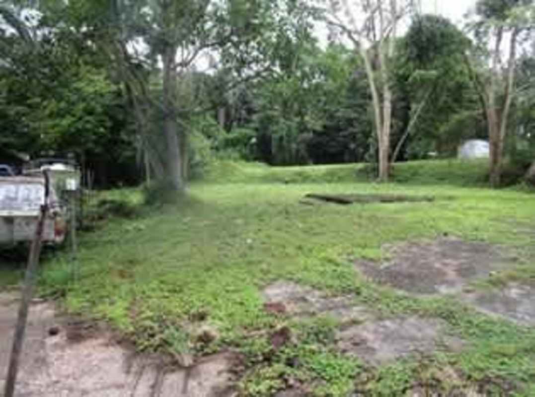 Empty lot adjoining quiet residential street in Diablo neighborhood Panama City