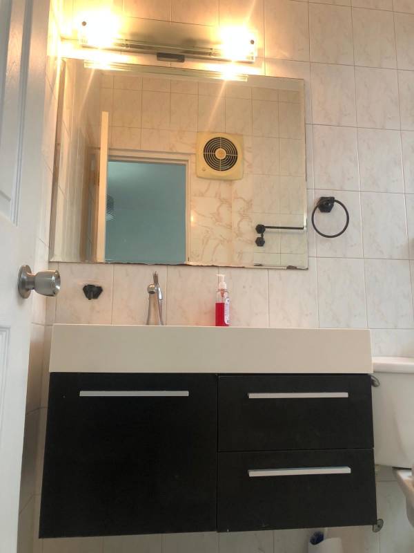 Bathroom with glass shower enclosure and modern vanity PH Royal Center Marbella Panama