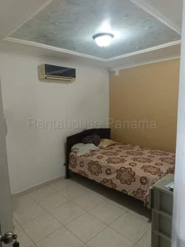 Bathroom with tile walls, walk-in shower, modern sink in Don Bosco Panama City