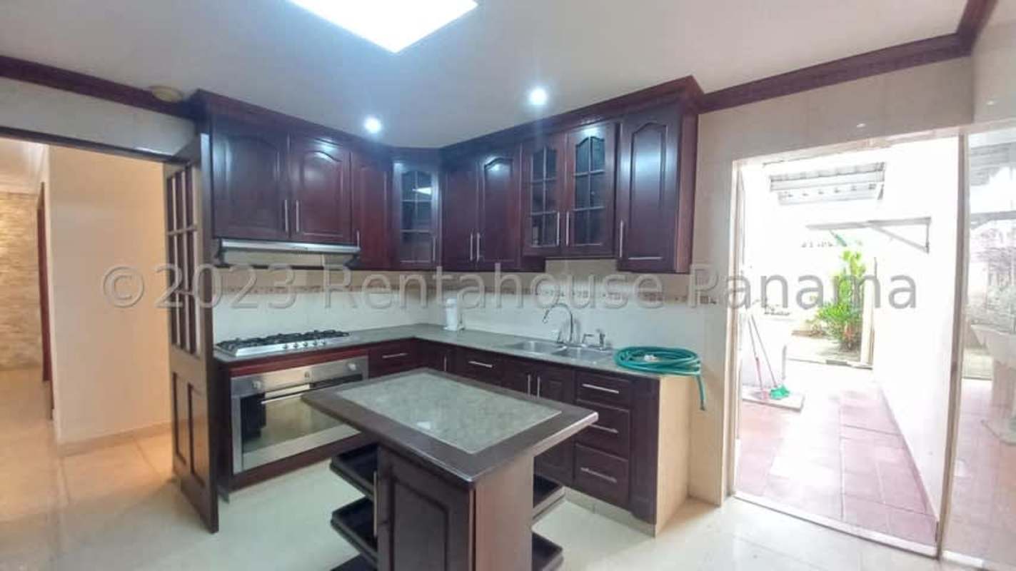 Family room with ceramic tile, ceiling medallion, and stairs at San Antonio Panama City