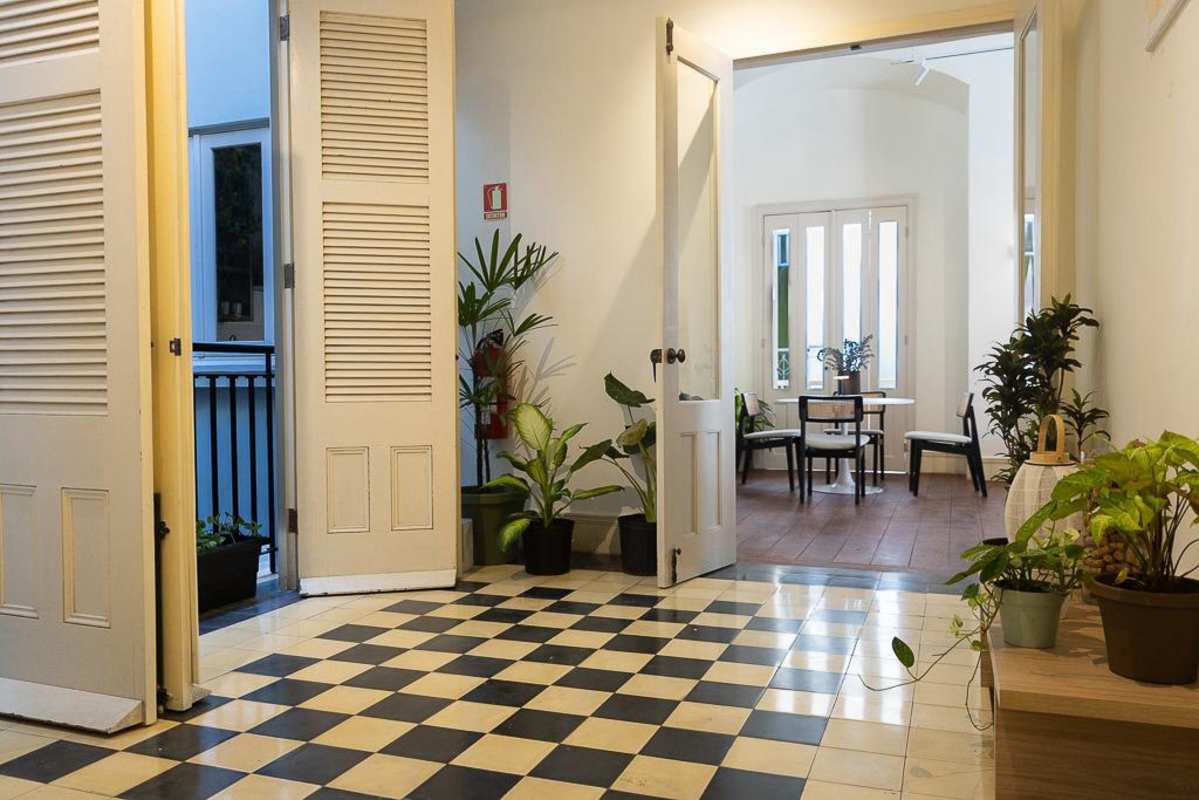 Colonial hallway with checkered floors, dining area and vintage decor Casco Viejo Panama