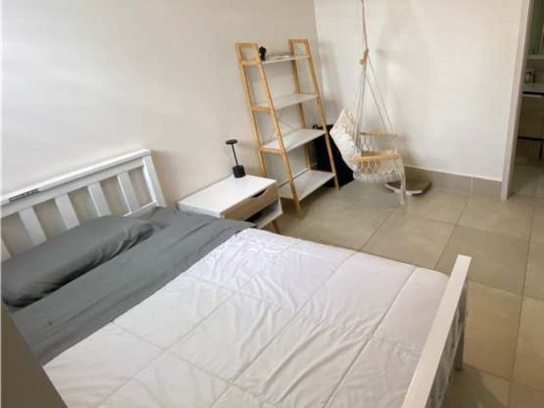 Comfortable bedroom with marble floor, built-in closet, city views in furnished Ocean House apartment Panama