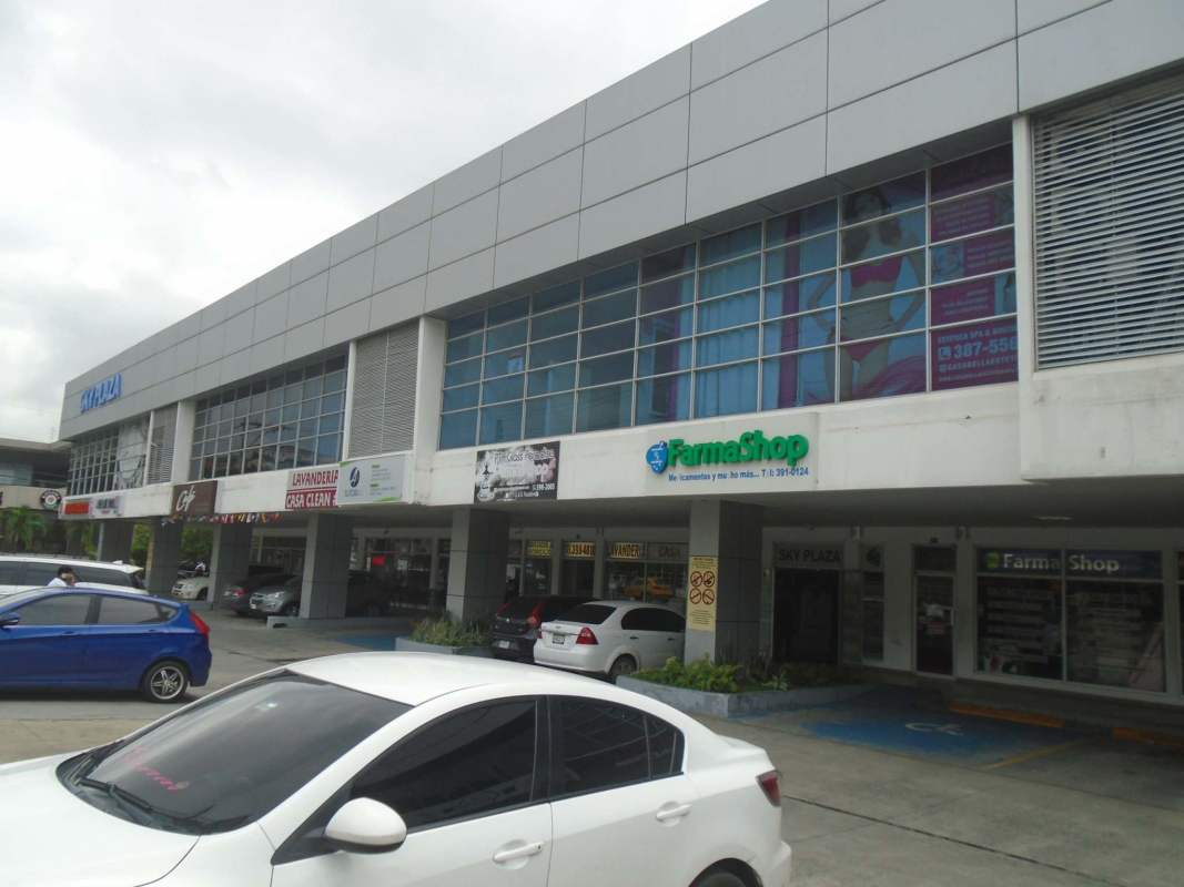 Compact restroom with patterned tile, toilet and sink in retail space Condado del Rey Panama