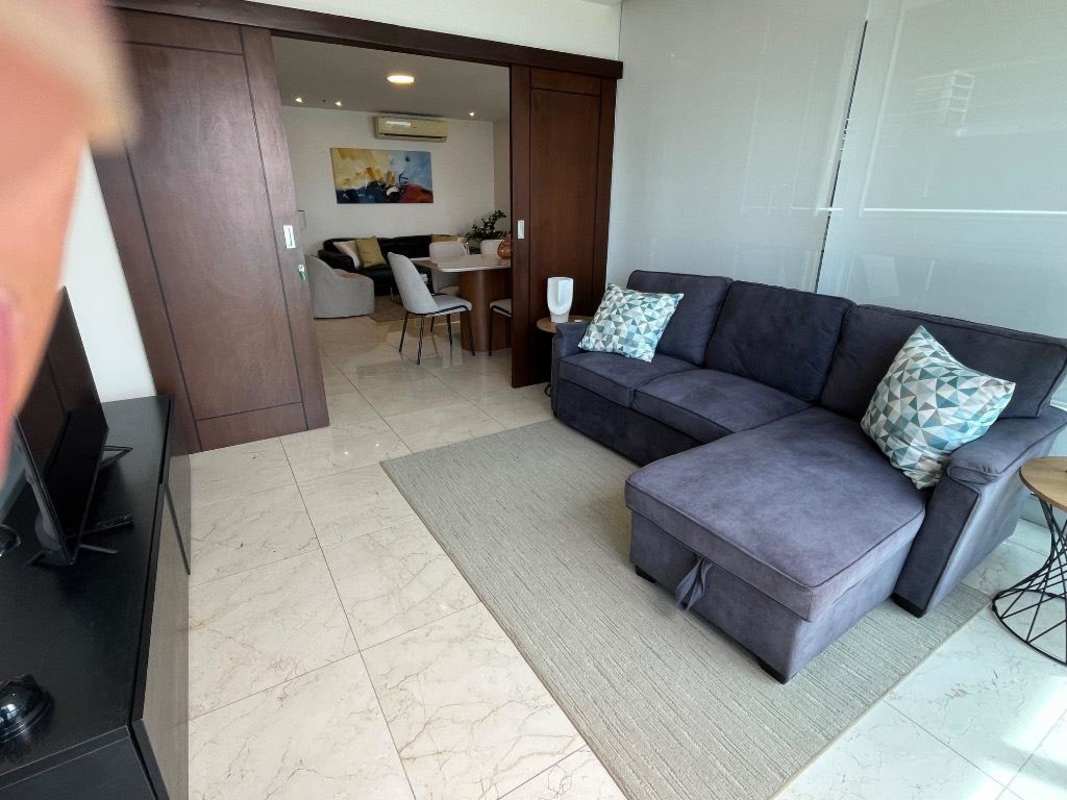 Modern master bedroom with large windows and walk-in closet at PH YOO Panama