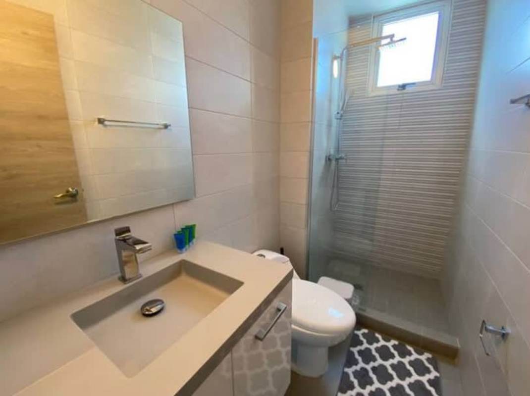 Modern bedroom with built-in closet in apartment at PH Signature Point Panama City