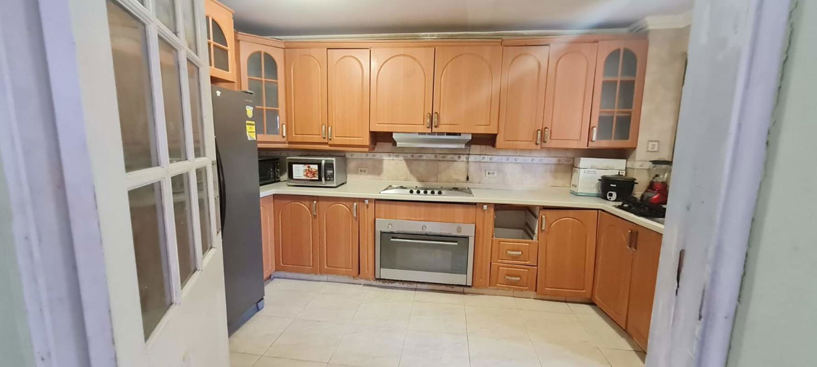 Spacious open-plan dining living with natural light in furnished house Brisas del Golf Panama