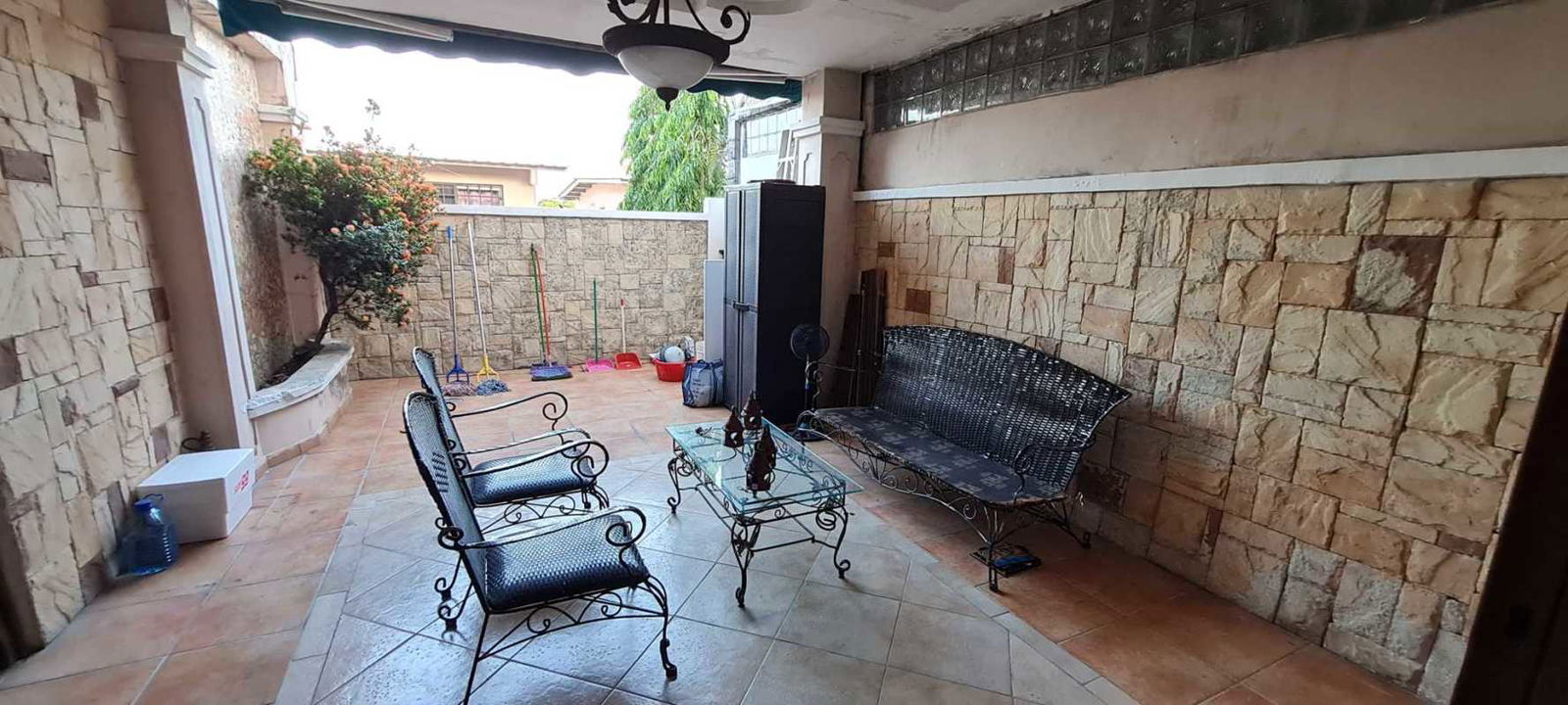 Bedroom with accent wall, window AC unit and ceramic floor Brisas del Golf Panama City