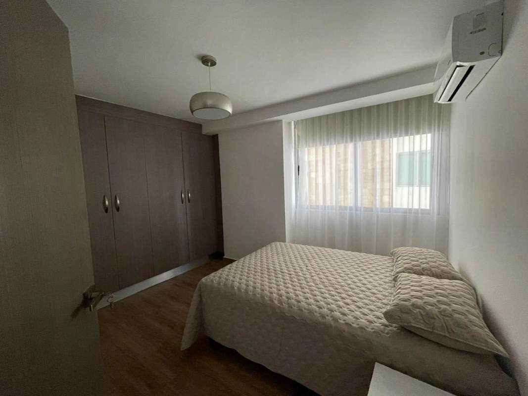 Second bedroom with built-in wardrobe split AC wooden flooring PH Lumiere Costa del Este Panama