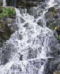 Waterfall and rock landscape within farmland Green Dream Los Tinajones Panama