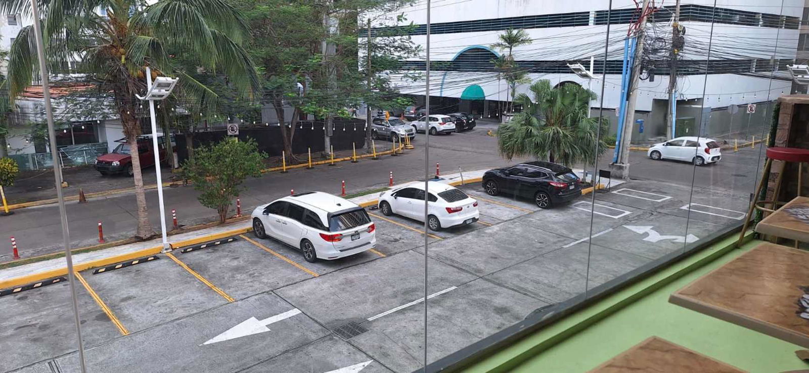 Retail parking lot with commercial units and palm trees at PH Balboa Boutiques Panama City Panama