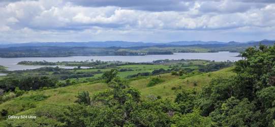 Panoramic image of Gatun Lake, wooded hills, and rural land Capira Panama