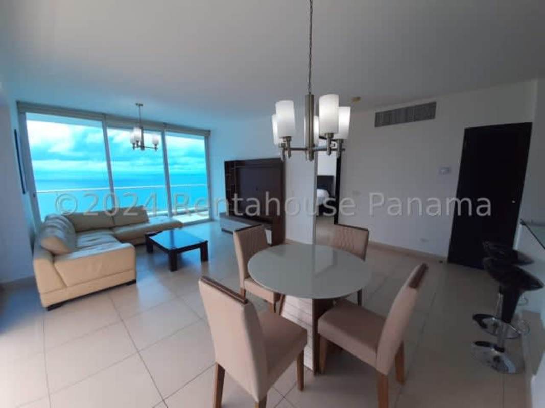 Living and dining area with panoramic ocean and city views in PH Destiny Tower Panama