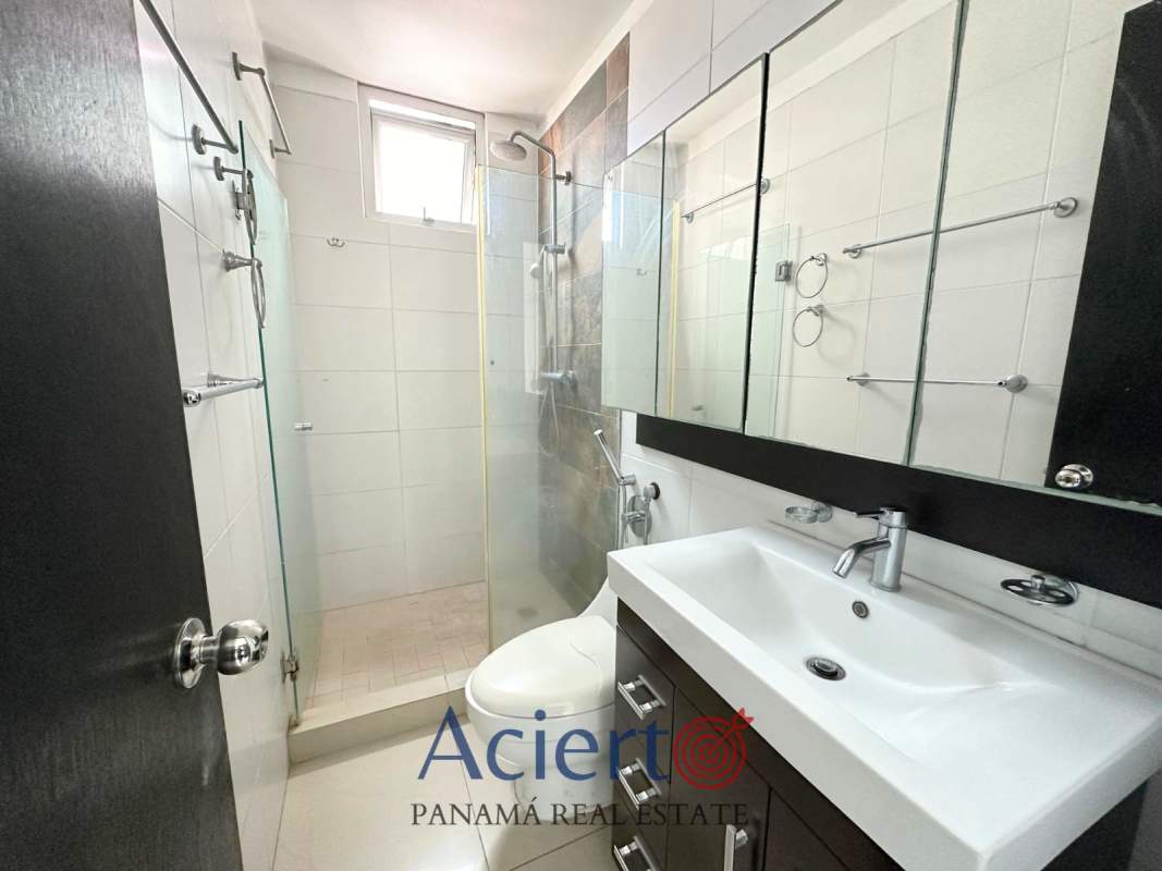 Elegant modern bathroom with glass enclosed shower and contemporary fixtures in PH Bayfront Panama