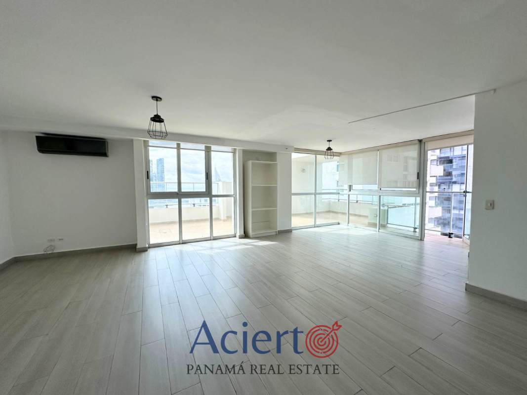 Large living dining room with balcony access, tile flooring, and city views in PH Bayfront Panama