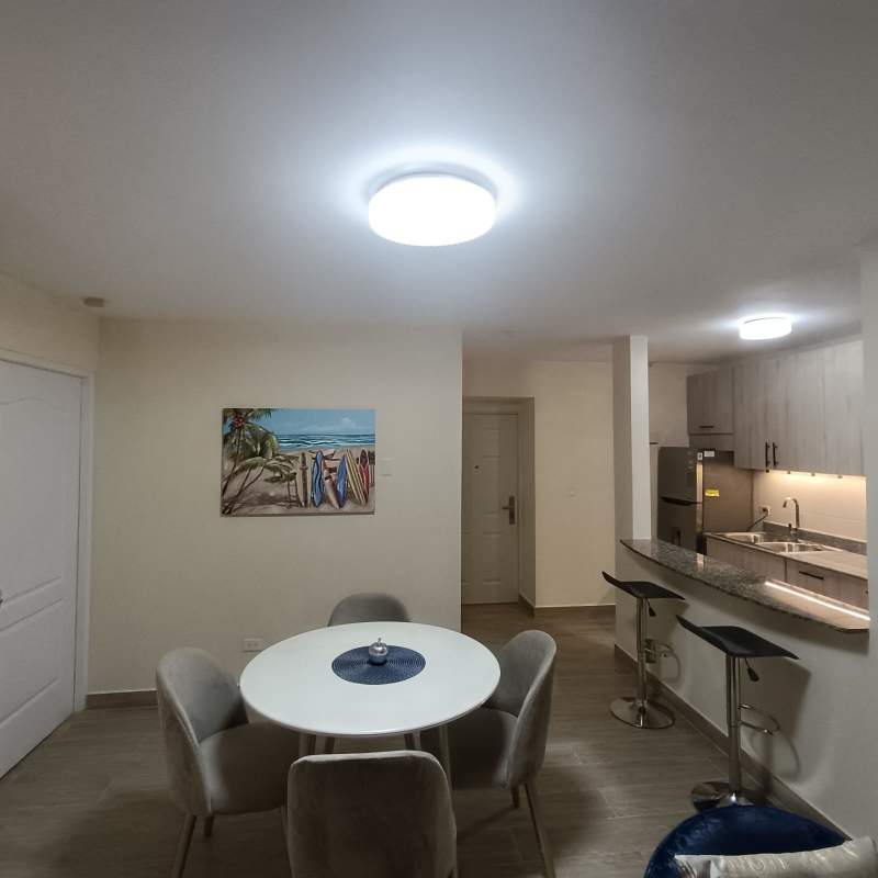 Dining area with round table, breakfast bar, modern design apartment Panama City