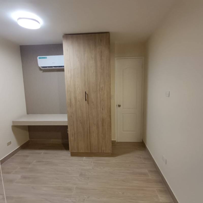 Minimalist bedroom with built-in wardrobe, desk, air conditioning in PH San Francisco Bay Panama