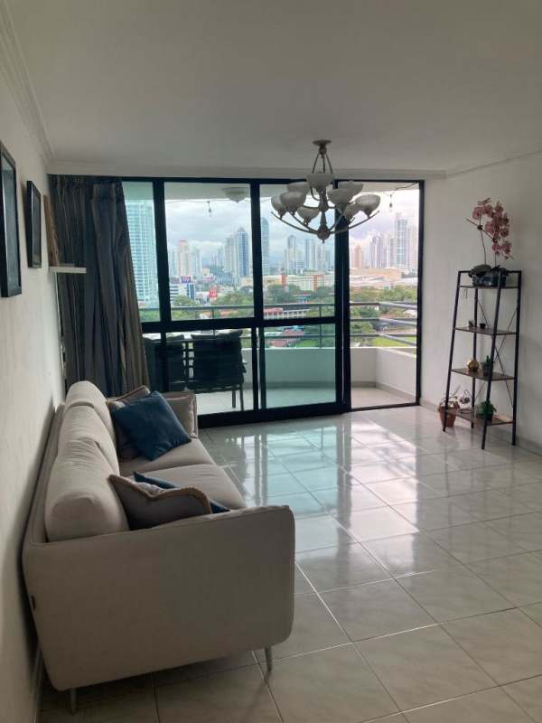 Bright living room with city skyline views balcony and modern decor PH Paitilla Panama