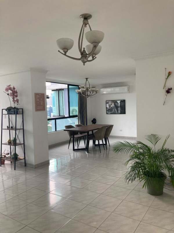 Dining space with natural light, large windows, city views in PH Paitilla Panama