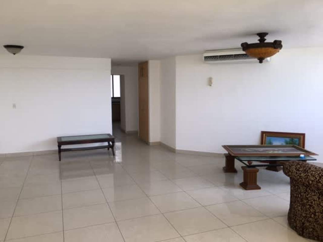 Spacious living room with tile floors and ocean view in PH Roca Mar Avenida Balboa Panama