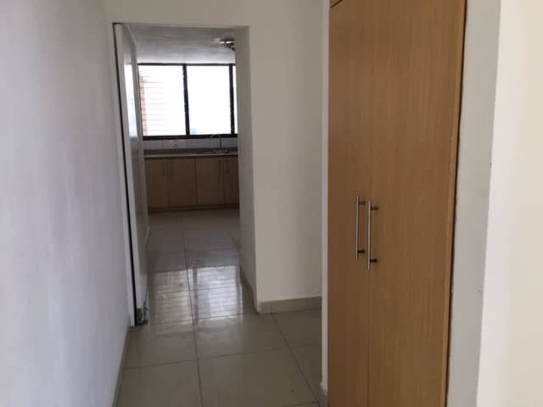 Apartment kitchen with granite counters and cabinetry in PH Roca Mar Panama City