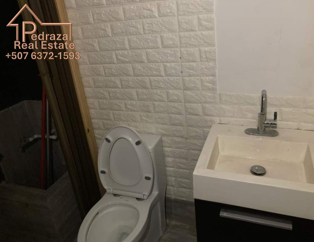 Open commercial interior with high ceiling, ceramic flooring inside Plaza 69 San Francisco