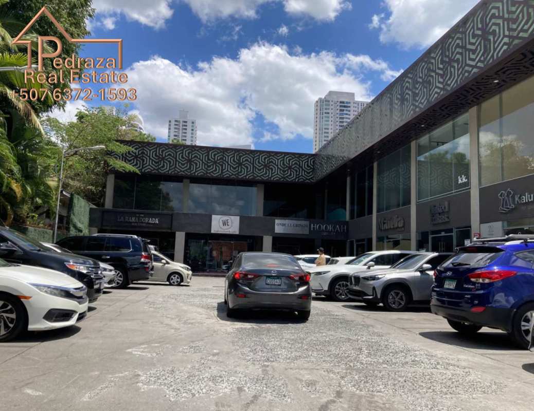 Two-story commercial plaza exterior with visitor parking Plaza 69 San Francisco Panama City