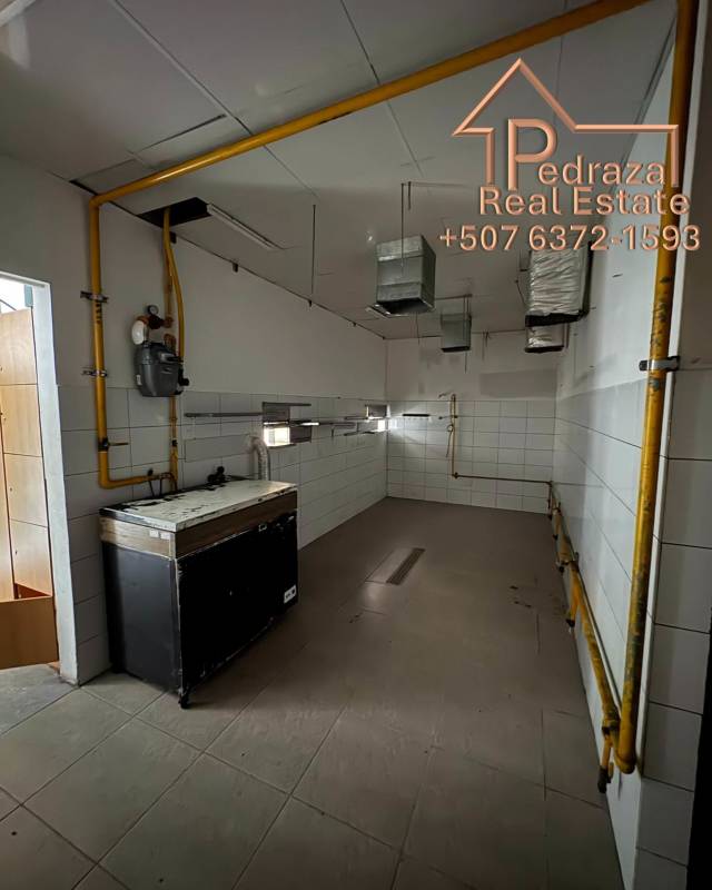 Tiled kitchen area with gas lines and ventilation ducts ready for restaurant use Panama