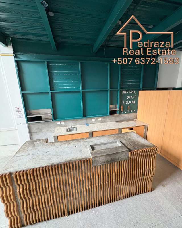 Teal accented bar with wood finish and concrete top commercial lease Panama