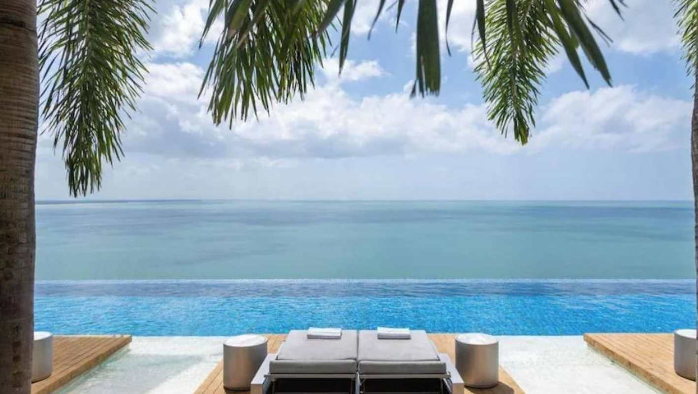 Spacious bedroom with king bed, balcony ocean view, in JW Marriott Panama high-rise condo