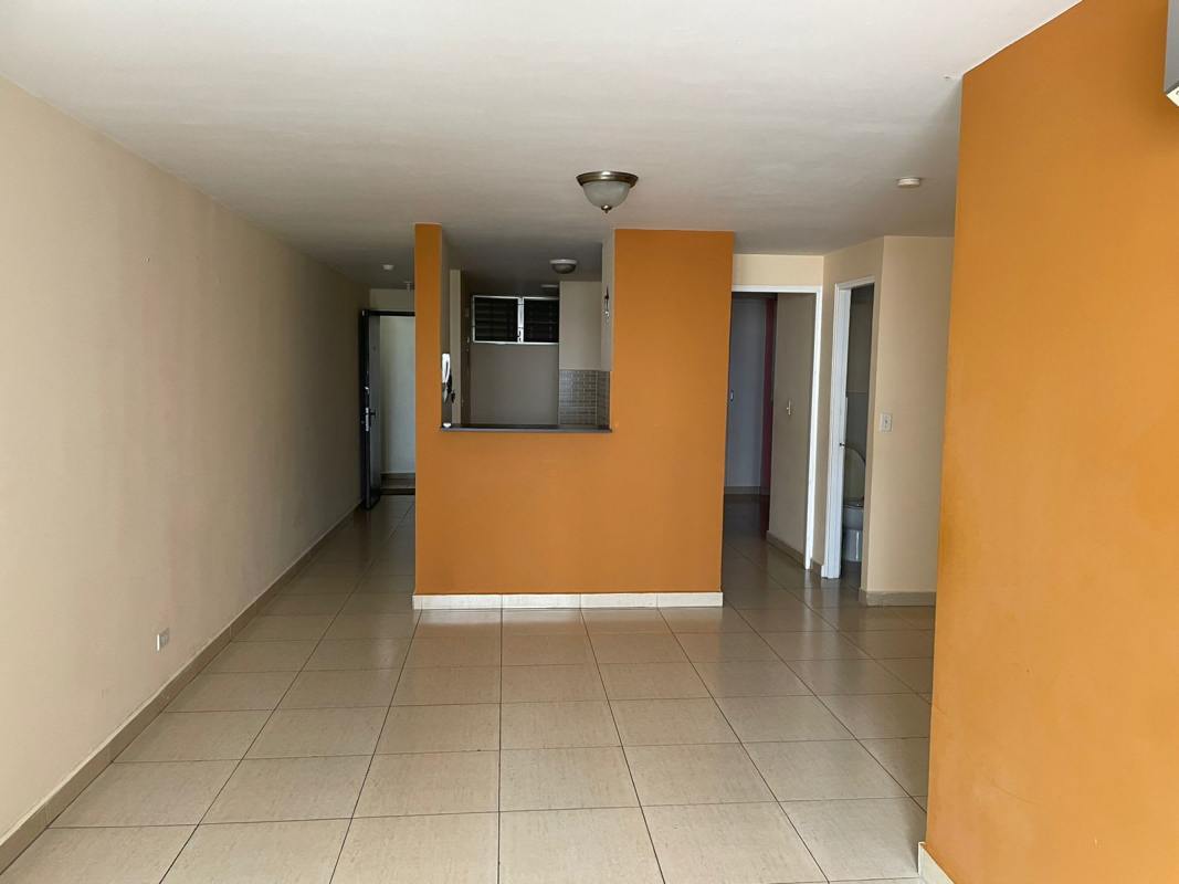 Bedroom with built-in closet and tile floor PH Sunflower Panama City