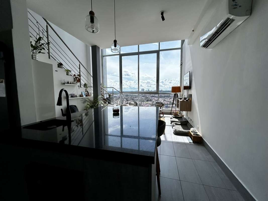 Modern kitchen with granite island and appliances in Sky Park Tower Panama