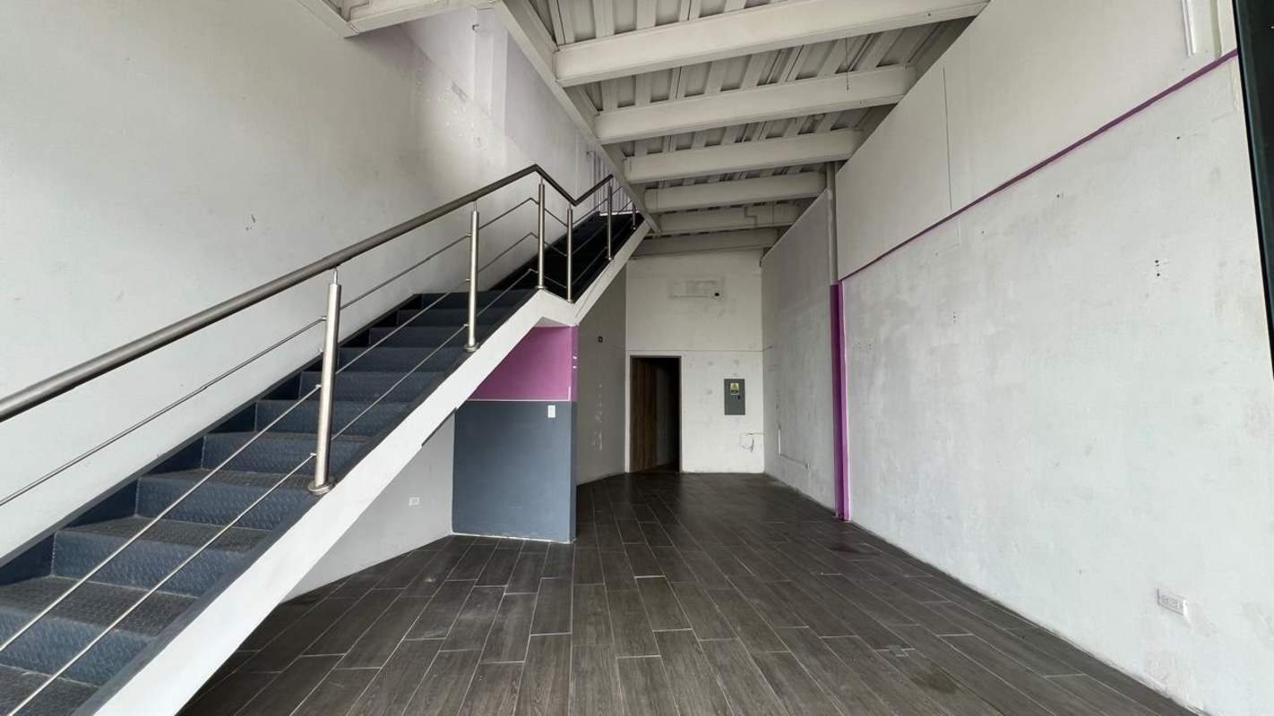 Open concept two-story commercial unit with metal staircase in Midtown Plaza Panama City