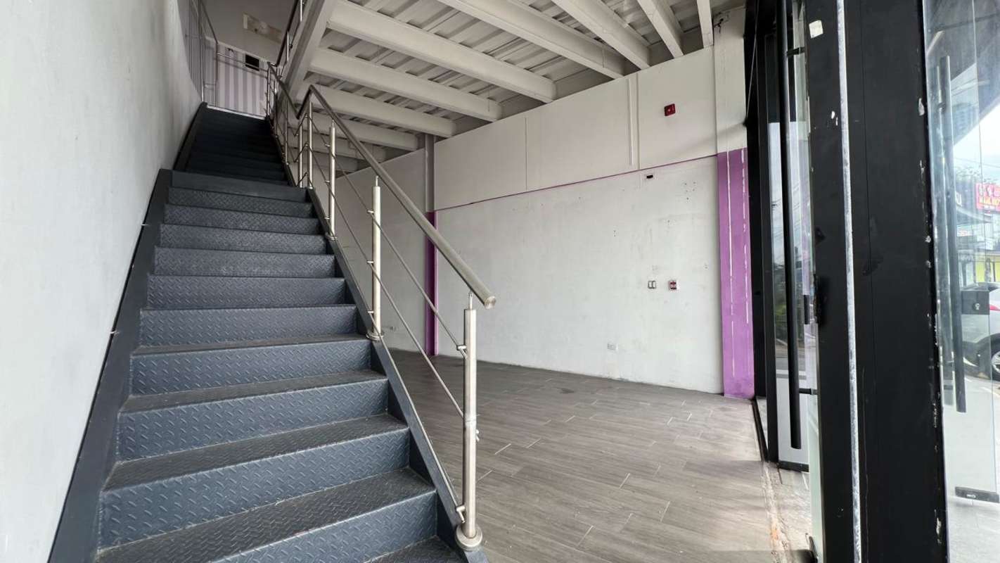 Upper mezzanine floor with metal railing at Midtown Plaza retail unit Panama City